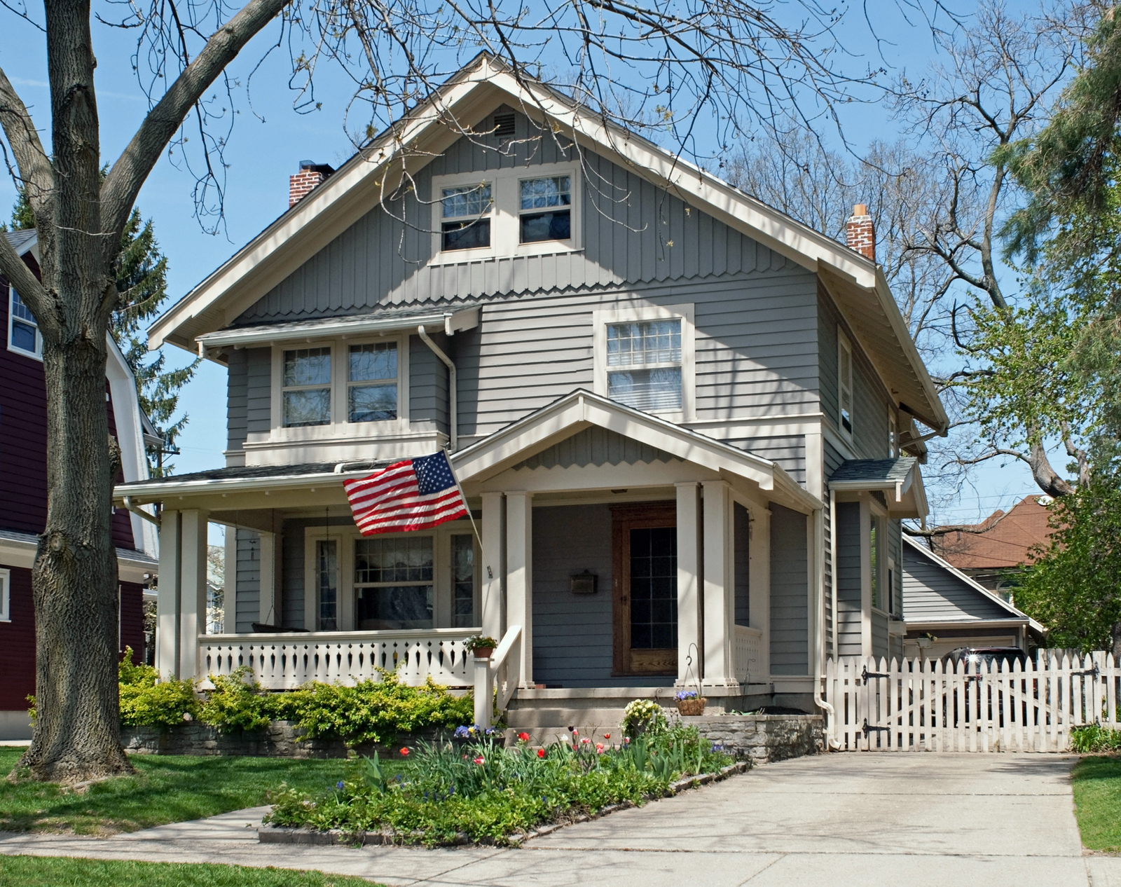 Classic American home with porch and flag in Mundelein, Illinois